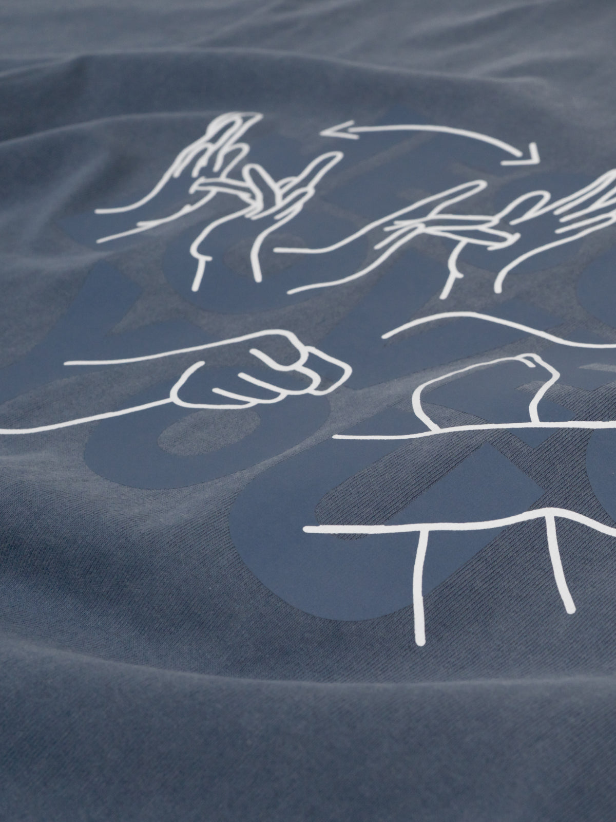 White line drawings of hands on a textured blue fabric background
