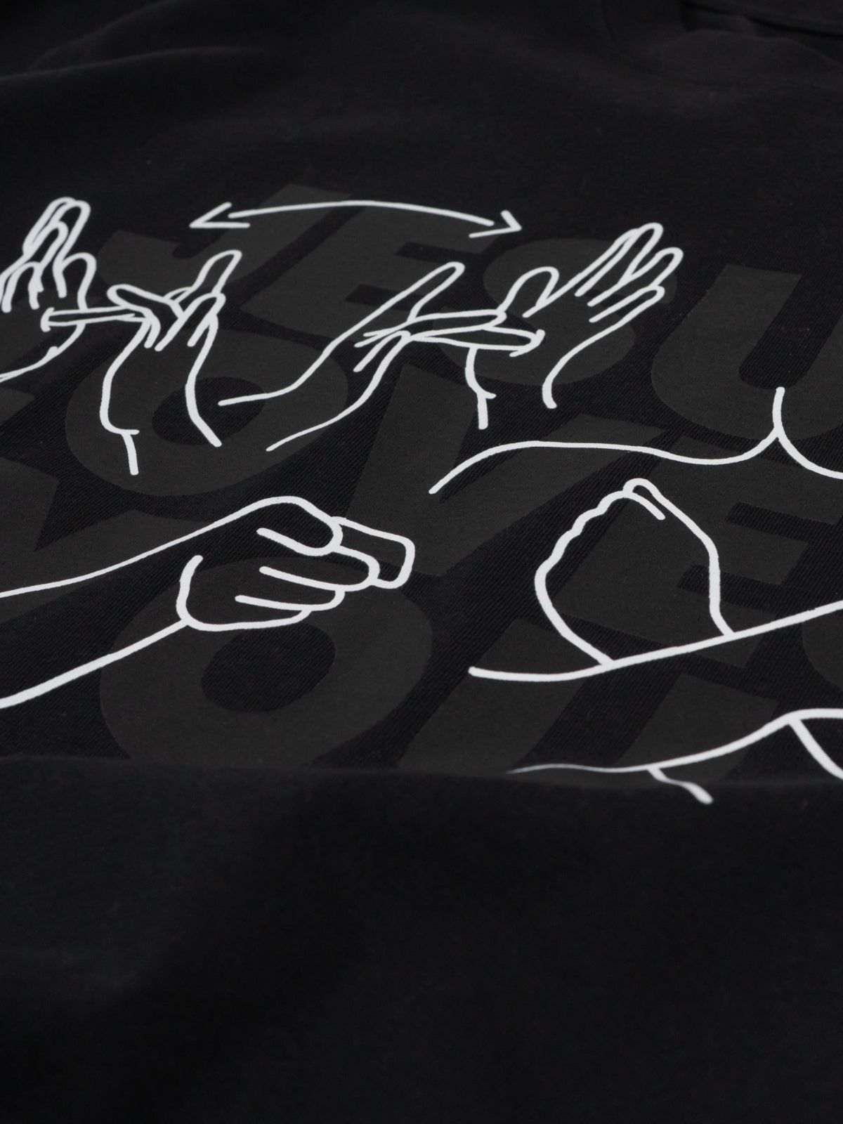 Black t-shirt with white line art of hands on a dark background