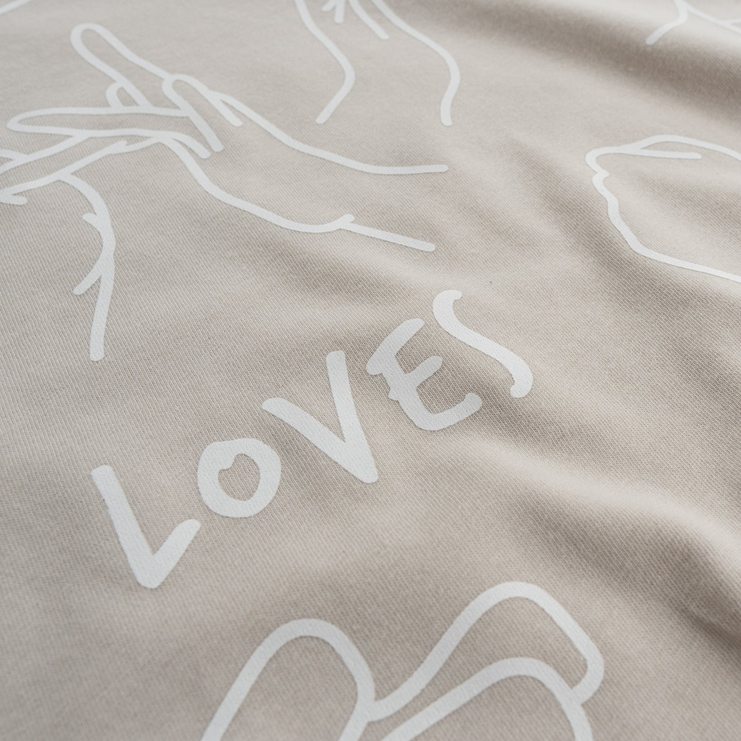 Oatmeal ASL T-shirt with front design of Jesus Loves You in sign language.