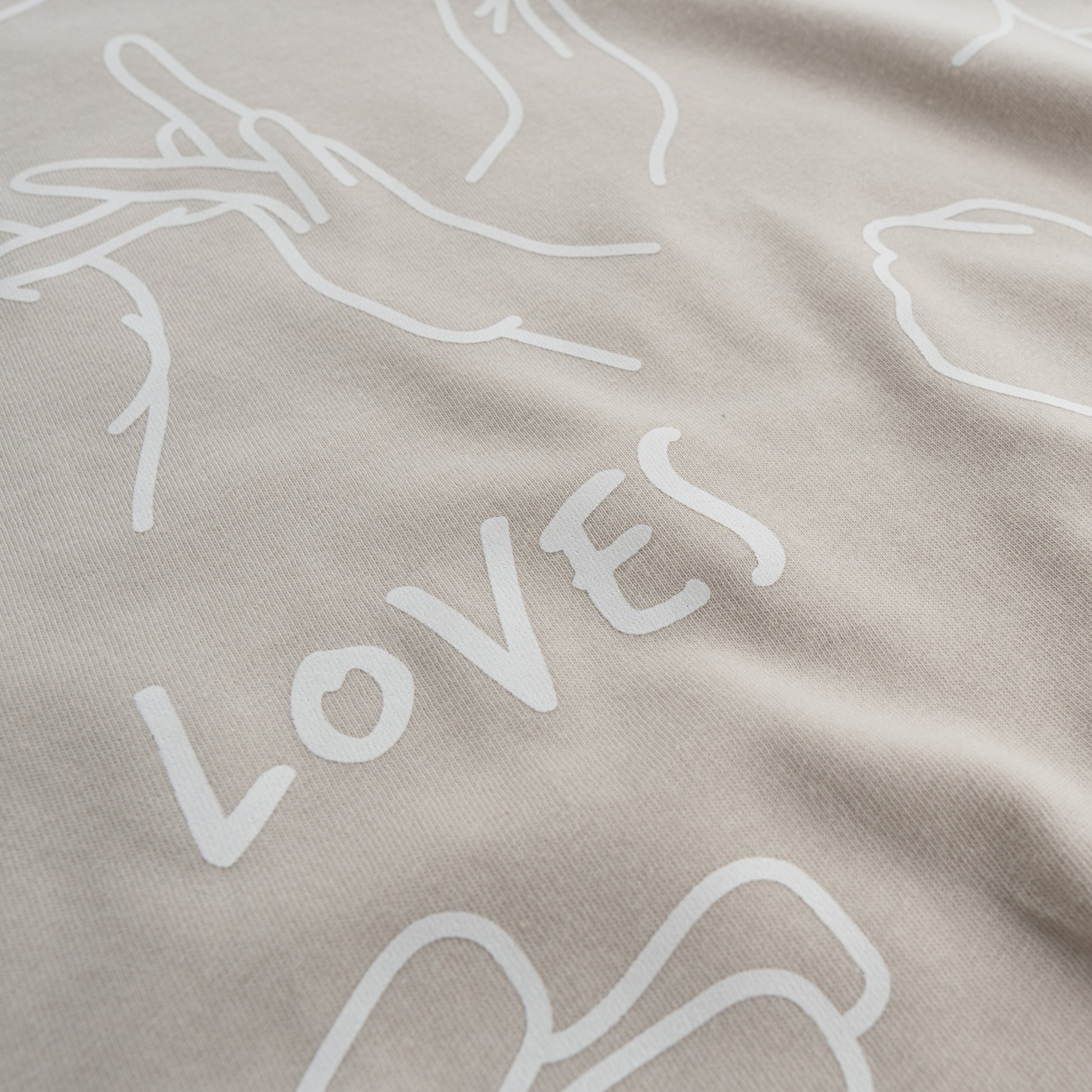 Oatmeal ASL T-shirt with front design of Jesus Loves You in sign language.