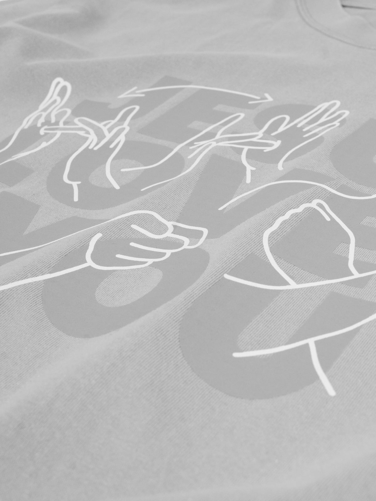 Gray t-shirt with white line art of hands and a heart design.