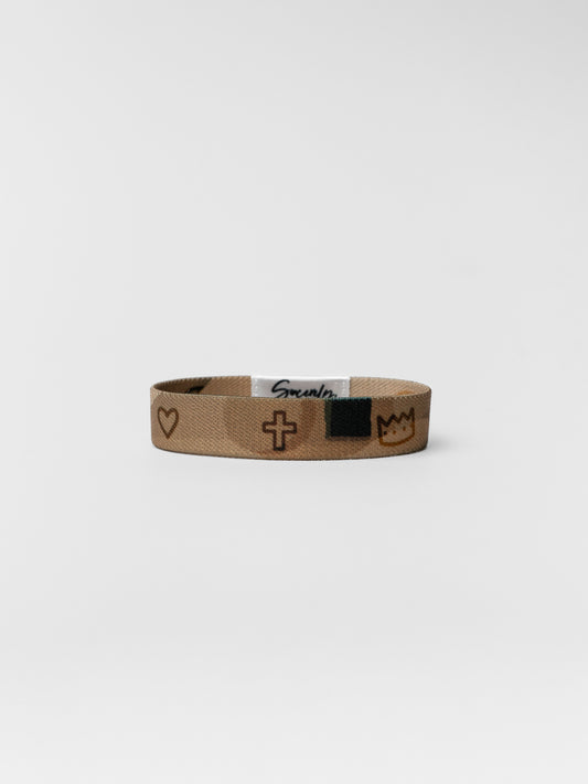 Brown wristband with symbols on a white background
