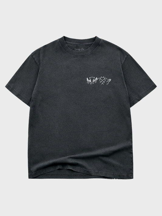 Black t-shirt with a small white graphic on a light gray background