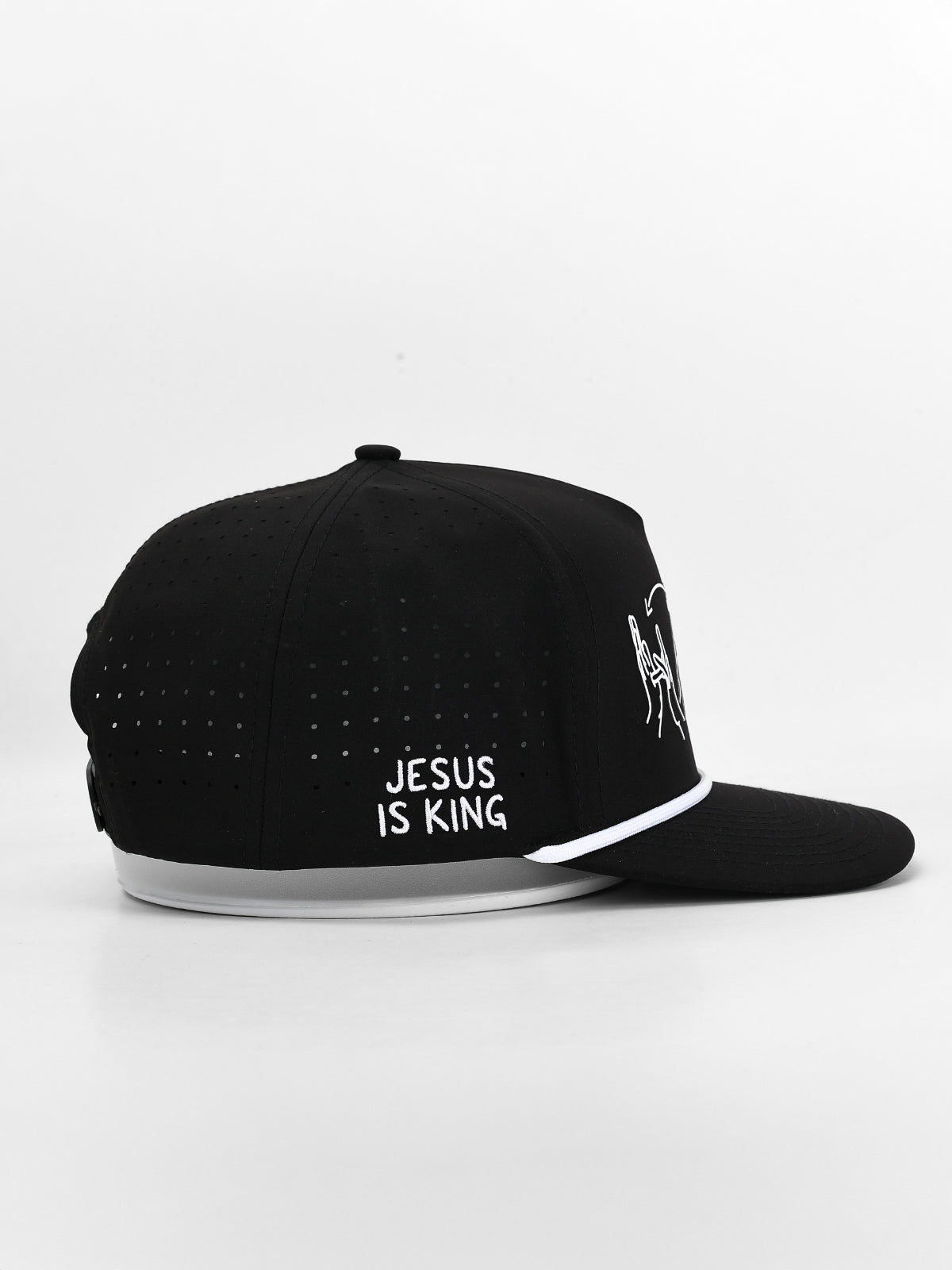 Black cap with 'Jesus is King' text on a white background