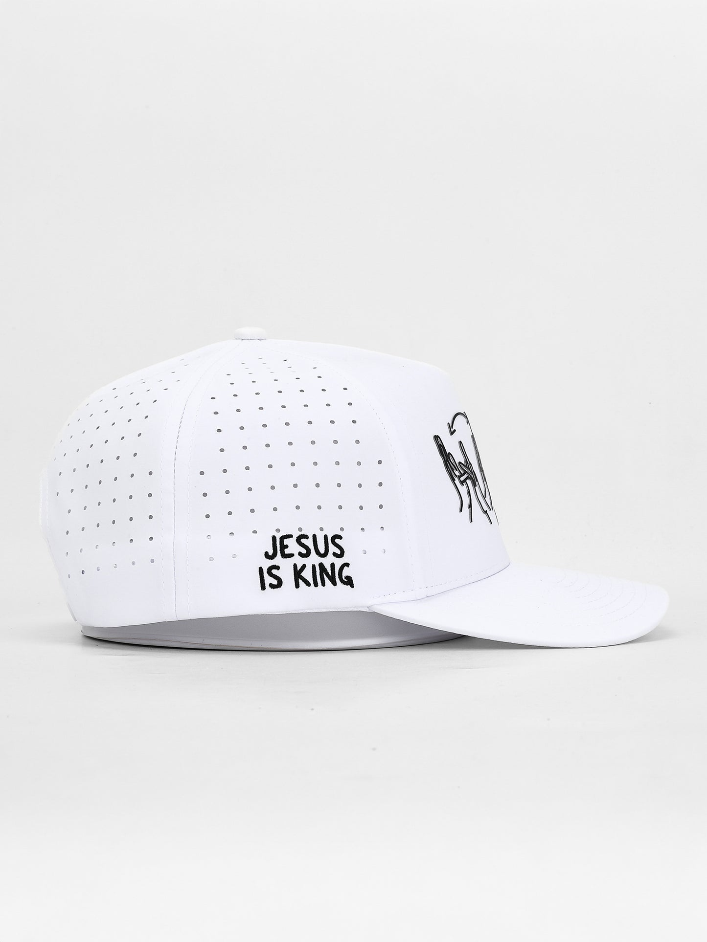 White cap with 'Jesus is King' text on a white background