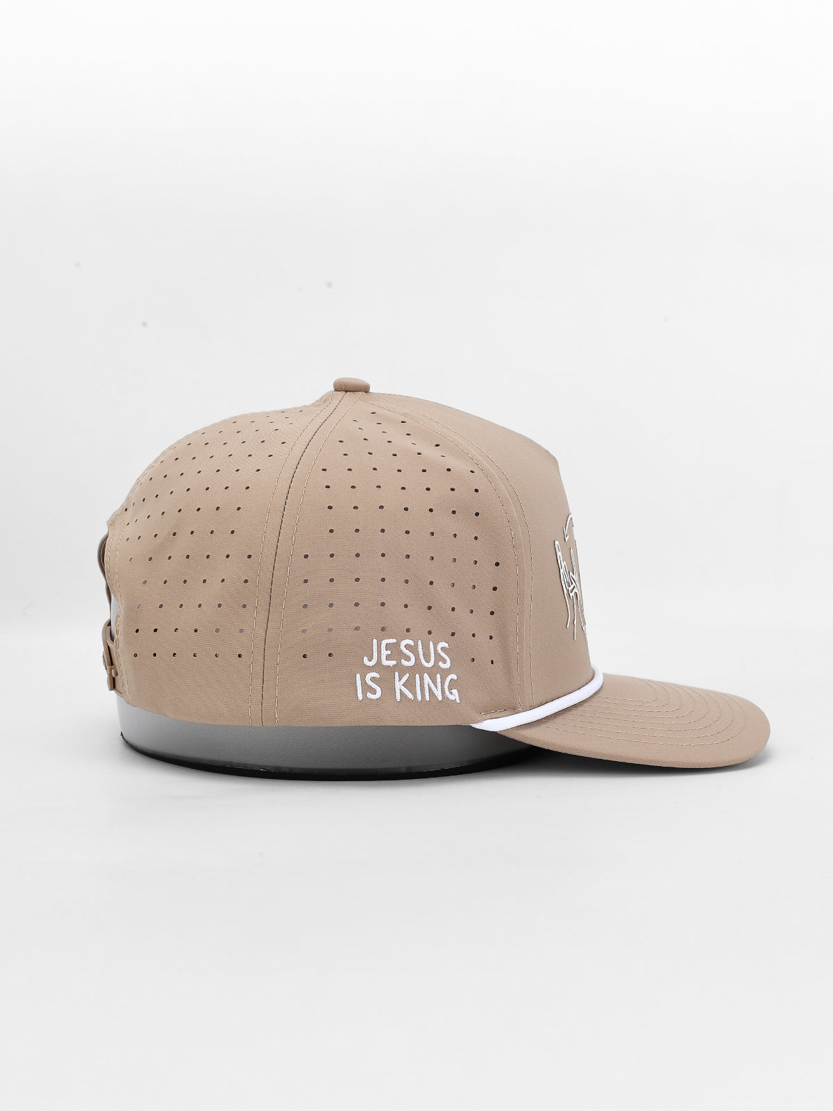 Beige cap with 'Jesus is King' text on a white background