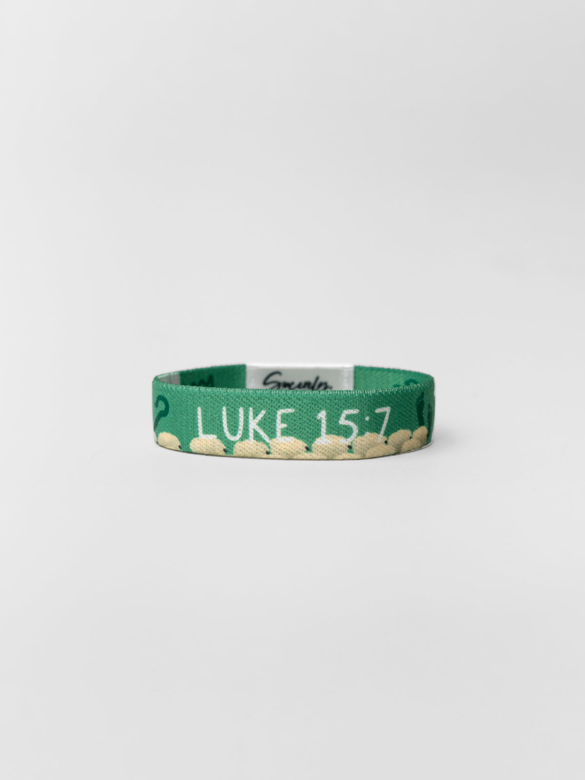 Green bracelet with 'Luke 15:7' text on a white background