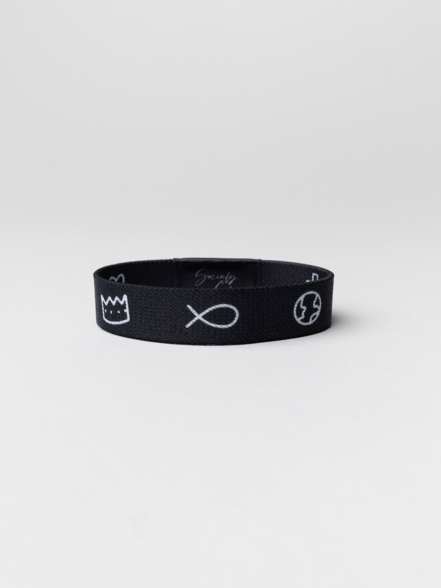 Black headband with white symbols on a light gray background
