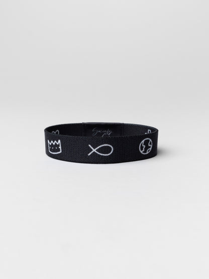 Black headband with white symbols on a light gray background