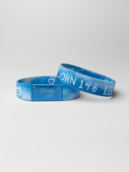 Two blue wristbands with text on a light gray background