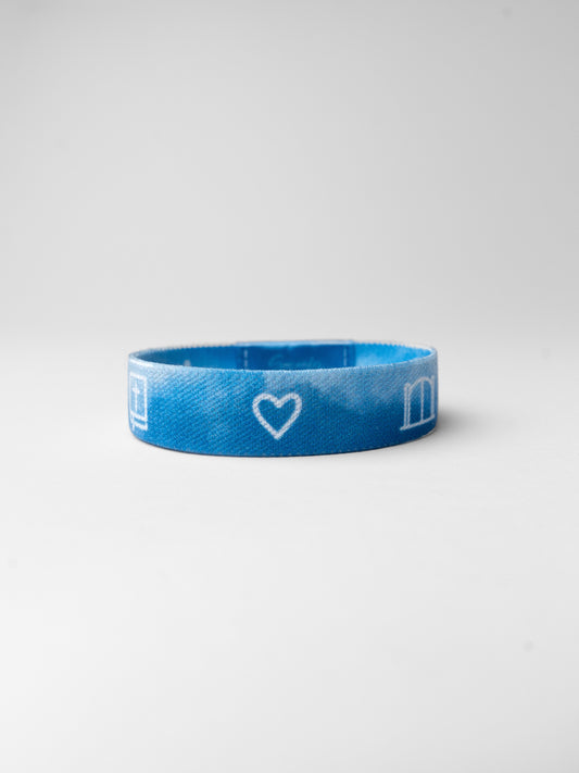 Blue wristband with a heart and letter 'm' on a white background
