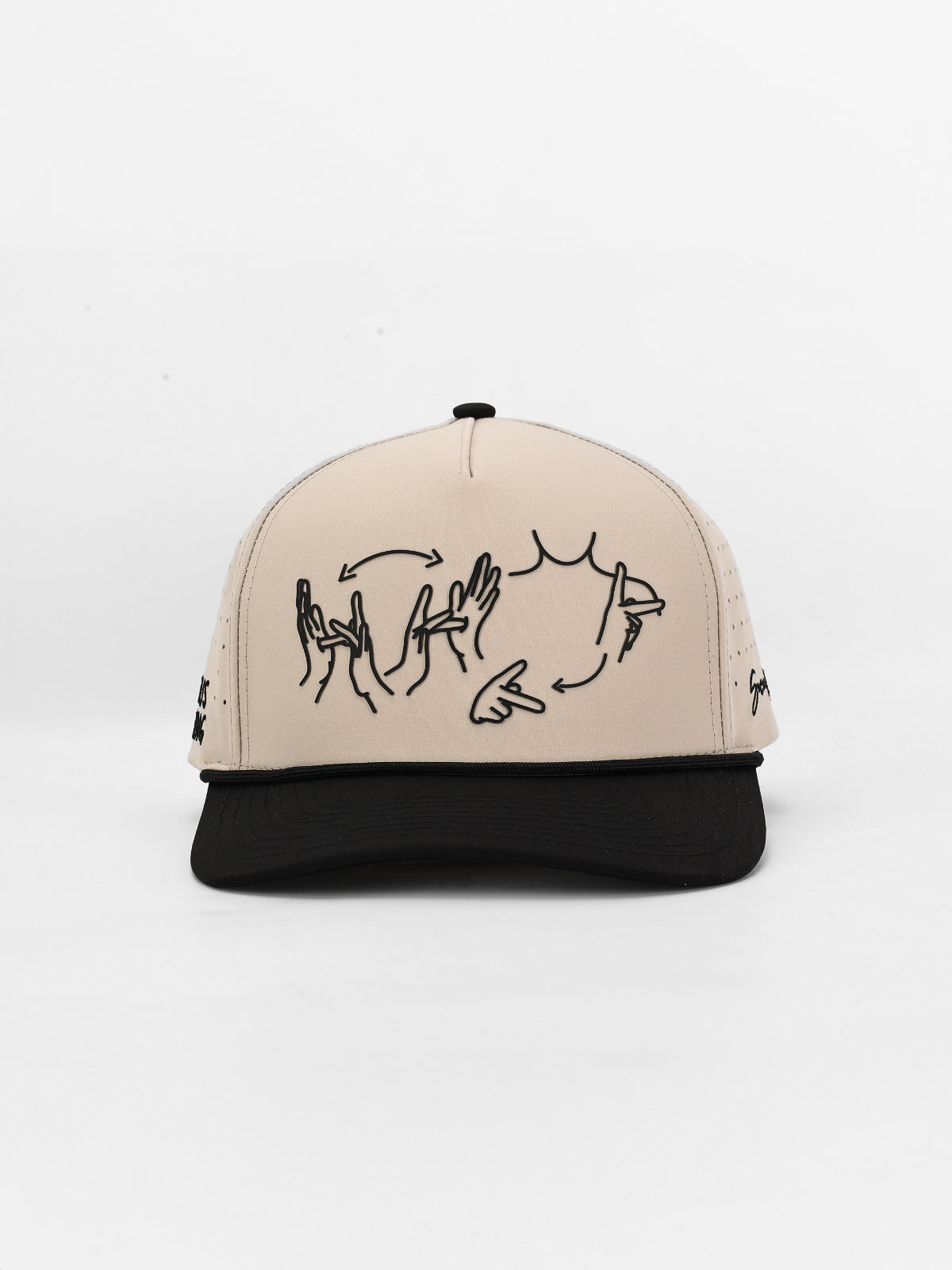 Beige and black cap with hand-drawn designs on a white background